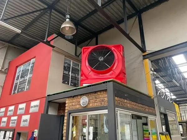 MaxCool Omega industrial evaporative cooler cooling a South African workshop