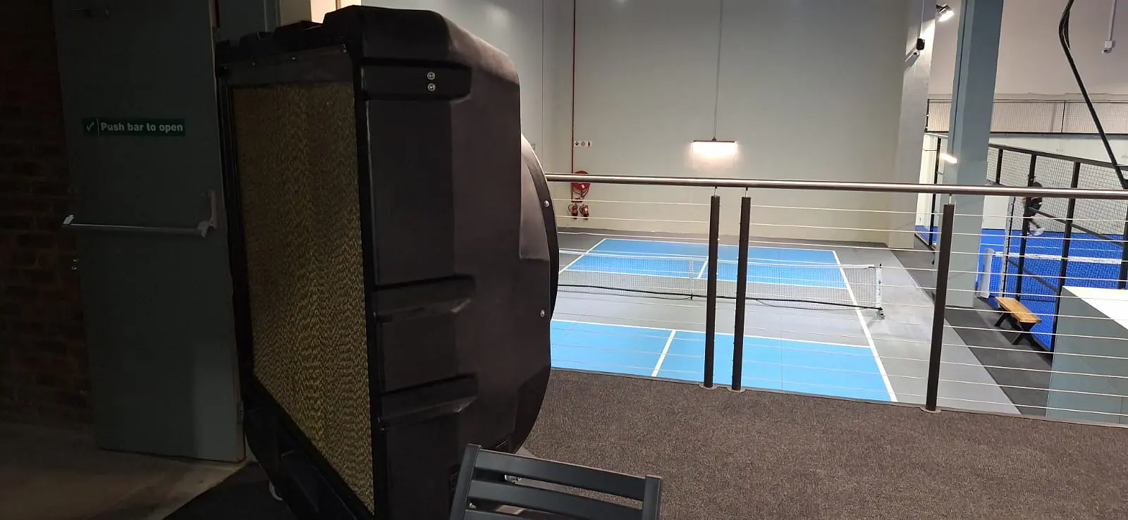 MaxCool Omega mobile evaporative cooler beside indoor padel courts at a South African padel club.