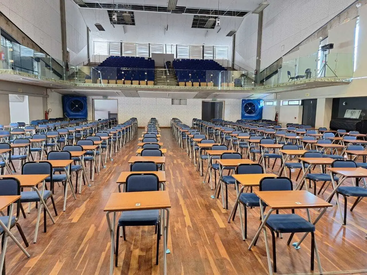 Two MaxCool Omega mobile evaporative coolers cooling a school hall